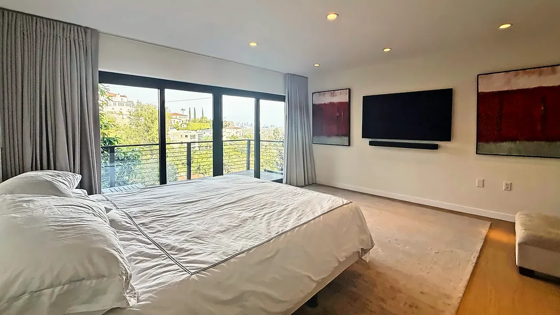 Bedroom with view windows and art